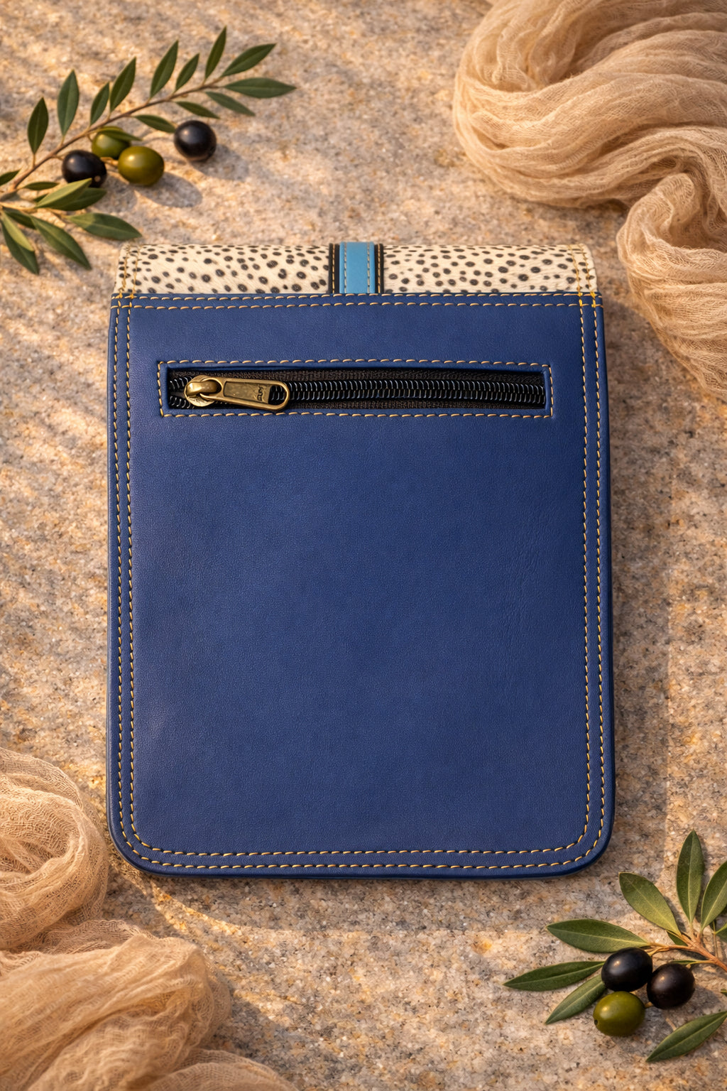 Handmade Leather Crossbody Bag with pink and blue design, featuring a spotted flap and a stylish closure.
