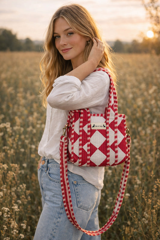 Handmade Cotton Mini Tote Bag with red and white diamond pattern, hanging on a wall, showcasing its stylish design.