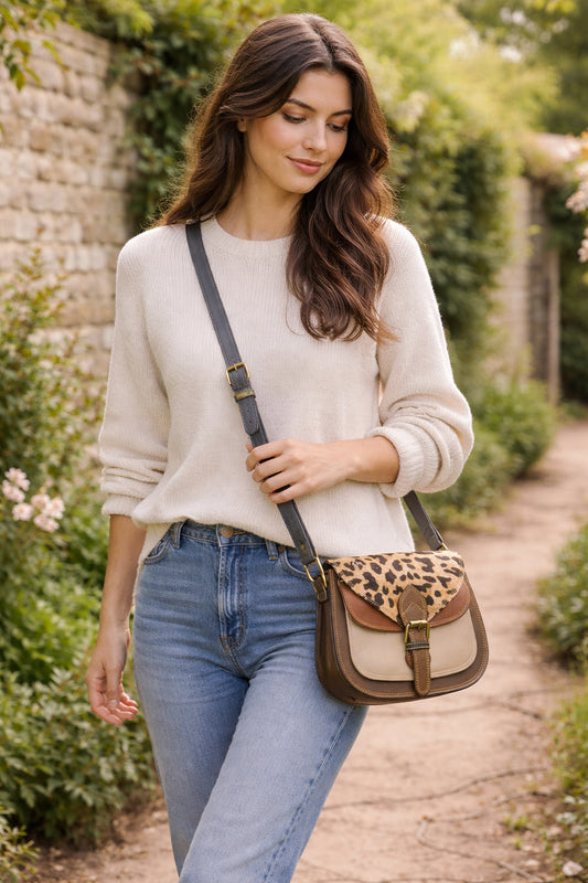 Handmade Leather Crossbody Bag featuring a leopard print flap with brown and green leather accents on a soft background.