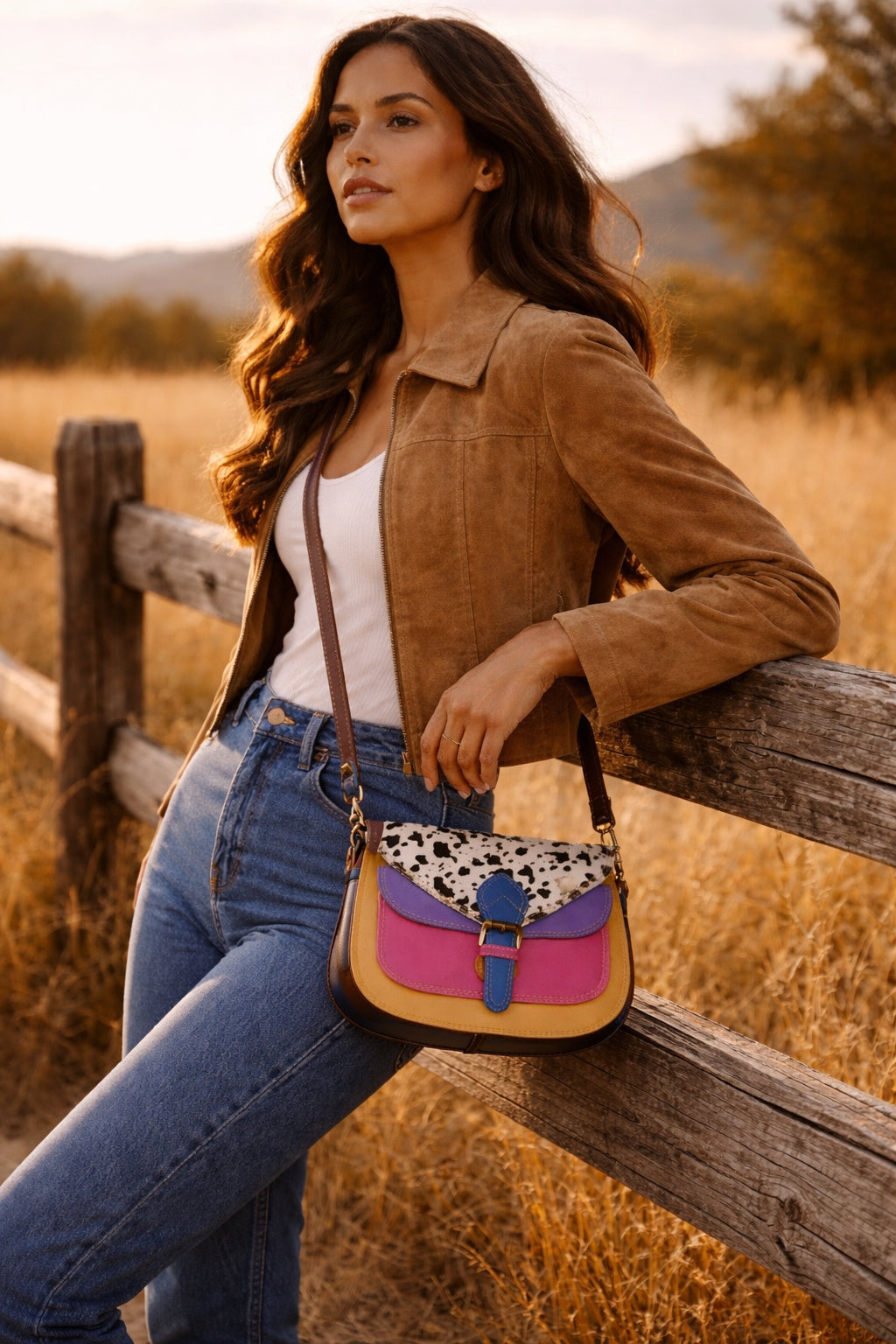 Handmade Leather Crossbody Bag featuring vibrant colors and a unique spotted design on the flap.