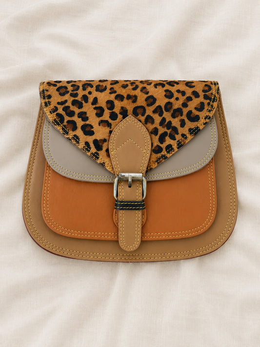Handmade Leather Crossbody Bag - Romy featuring a unique leopard print flap and multiple earthy tones.