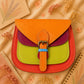 A Handmade Leather Crossbody Bag with vibrant colors, featuring an orange, green, and purple design, surrounded by floral accents.