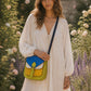 Handmade Leather Crossbody Bag - Romy - Painted Garden - Citrine on a soft background with dried flowers.