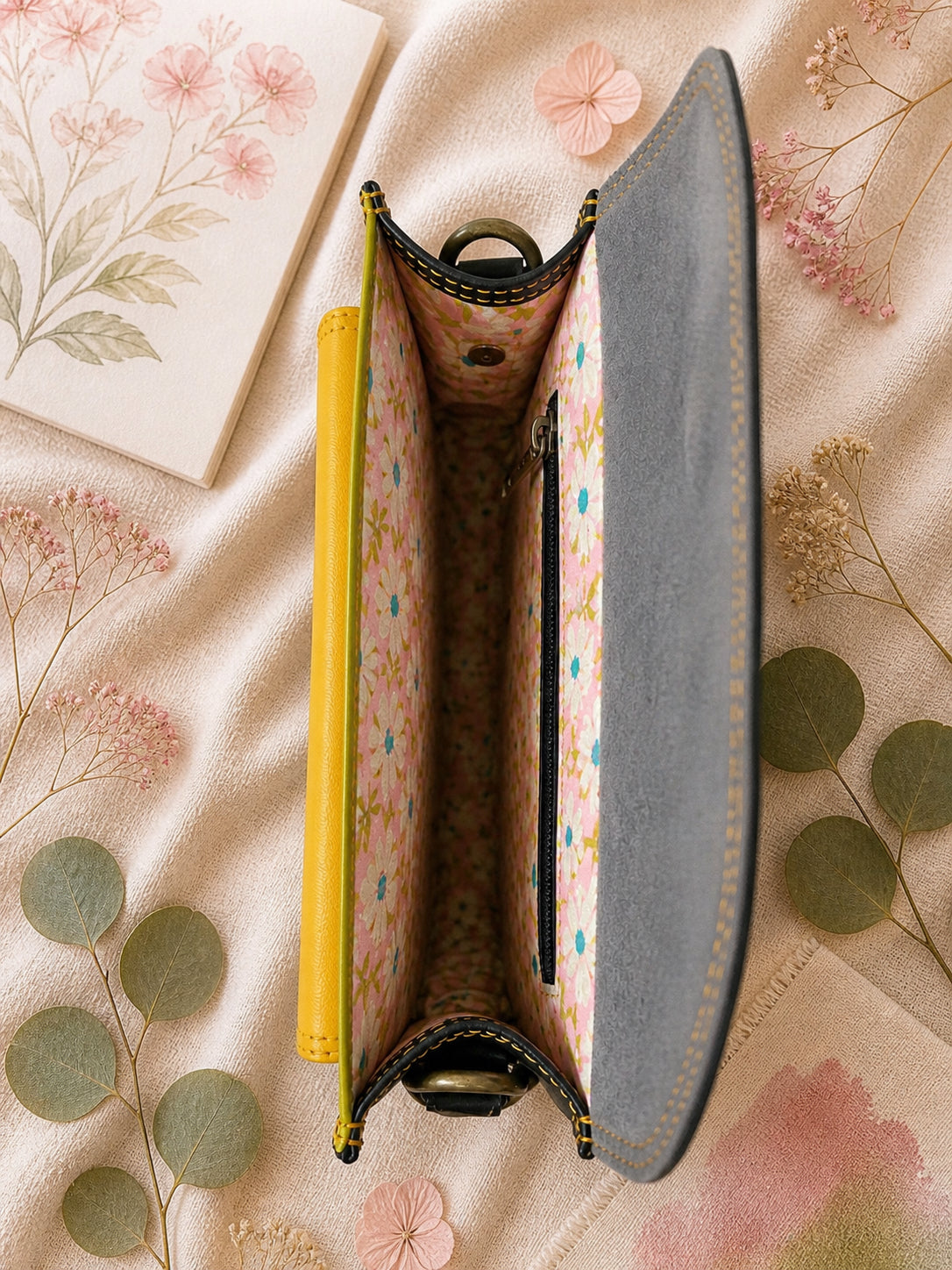 Handmade Leather Crossbody Bag with vibrant colors and zebra print flap on a floral background.