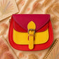 Handmade Leather Crossbody Bag in vibrant red and yellow with floral background.