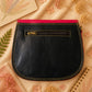 Handmade Leather Crossbody Bag in vibrant red and yellow with floral background.