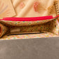 Handmade Leather Crossbody Bag in vibrant red and yellow with floral background.