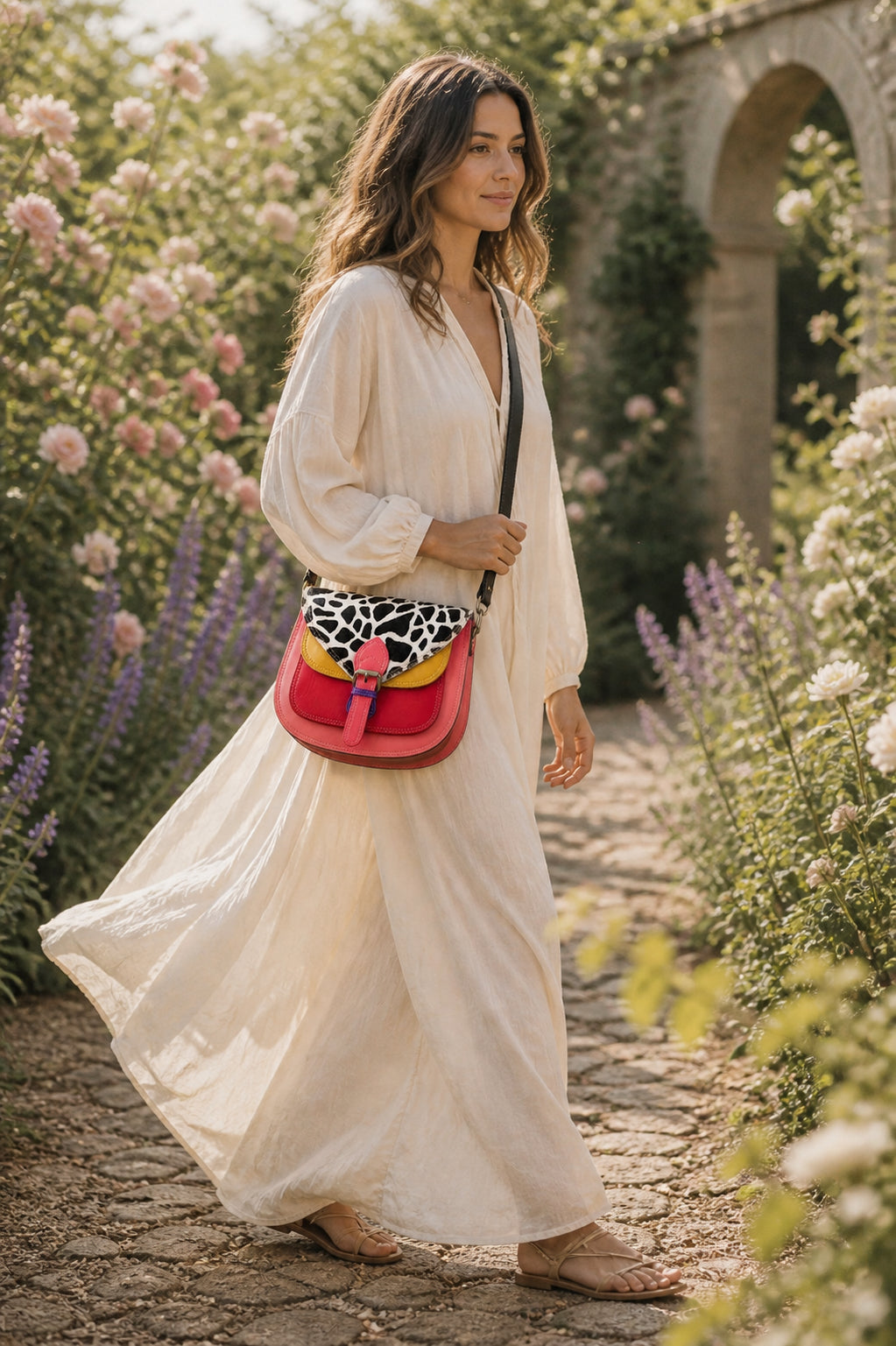 Handmade Leather Crossbody Bag featuring a vibrant painted design with pink, yellow, and animal print accents.
