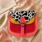Handmade Leather Crossbody Bag featuring a vibrant painted design with pink, yellow, and animal print accents.
