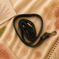 Handmade Leather Crossbody Bag featuring a vibrant painted design with pink, yellow, and animal print accents.