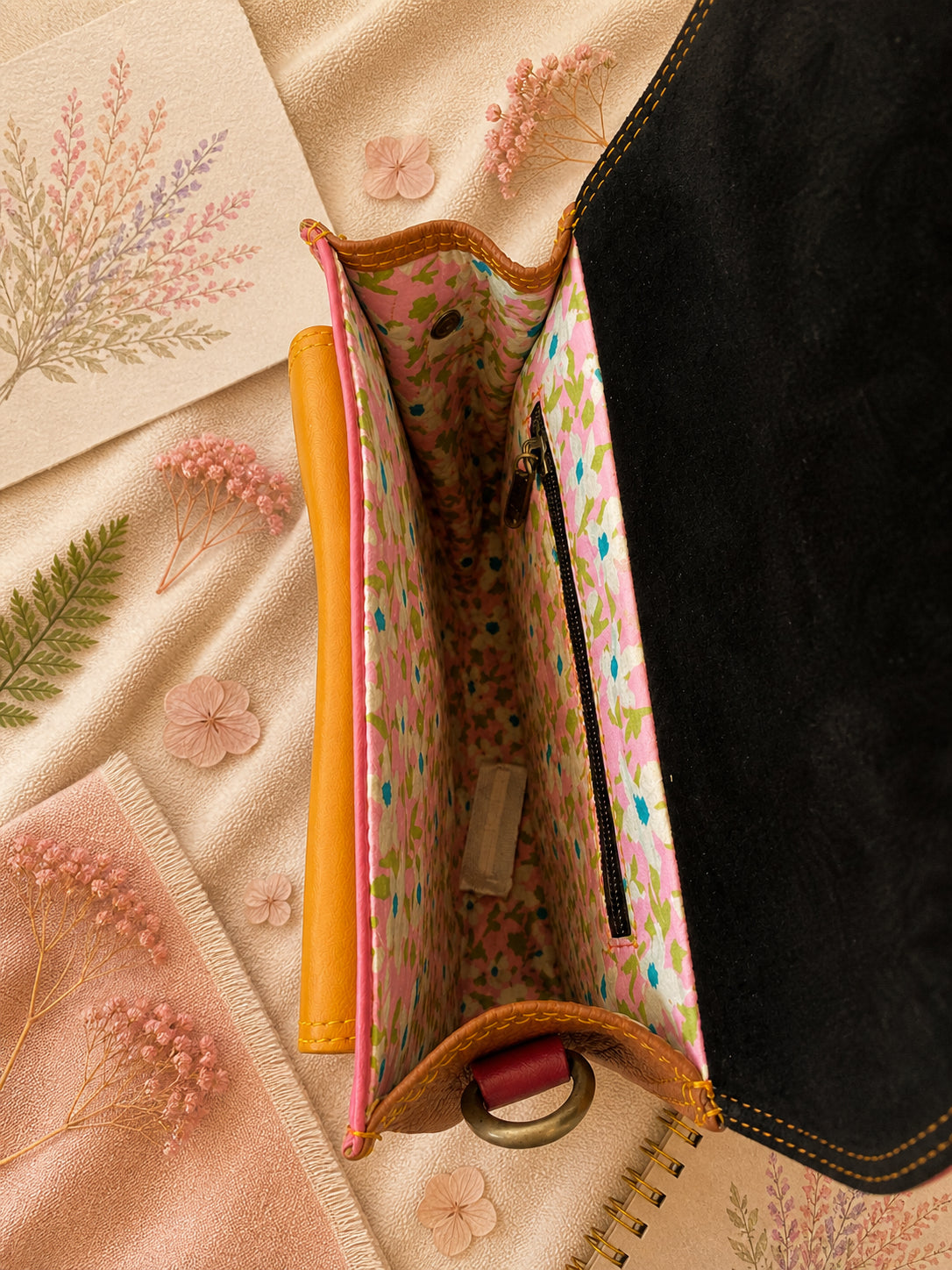 Handmade Leather Crossbody Bag featuring a vibrant painted design with pink, yellow, and animal print accents.