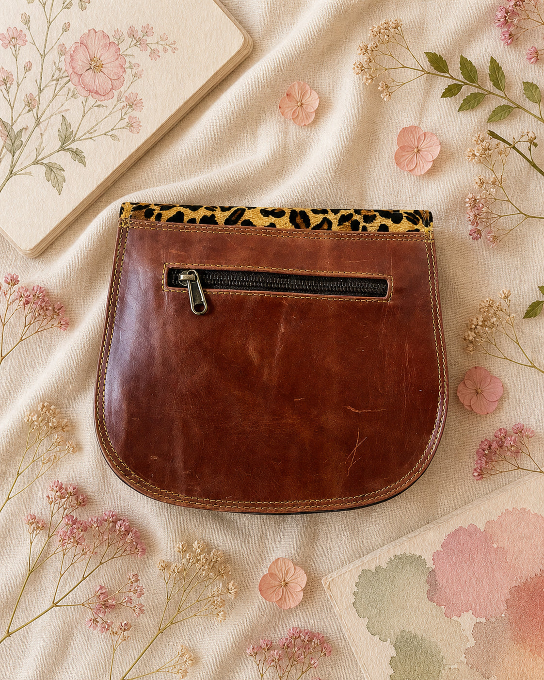 Handmade Leather Crossbody Bag featuring vibrant colors and leopard print flap design, perfect for stylish everyday use.
