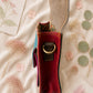 Handmade Leather Crossbody Bag featuring a colorful design with pink, blue, and patterned accents, showcasing unique craftsmanship.