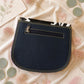 Handmade Leather Crossbody Bag featuring a colorful design with pink, blue, and patterned accents, showcasing unique craftsmanship.