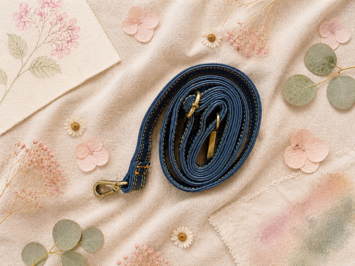 Handmade Leather Crossbody Bag featuring a colorful design with pink, blue, and patterned accents, showcasing unique craftsmanship.