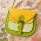 Handmade Leather Crossbody Bag - Romy - Painted Garden - Primrose in vibrant yellow and green leather with floral background.