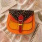 Handmade Leather Crossbody Bag - Romy - Painted Garden - Saffron featuring vibrant orange and leopard print design.