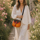 Handmade Leather Crossbody Bag - Romy - Painted Garden - Saffron featuring vibrant orange and leopard print design.