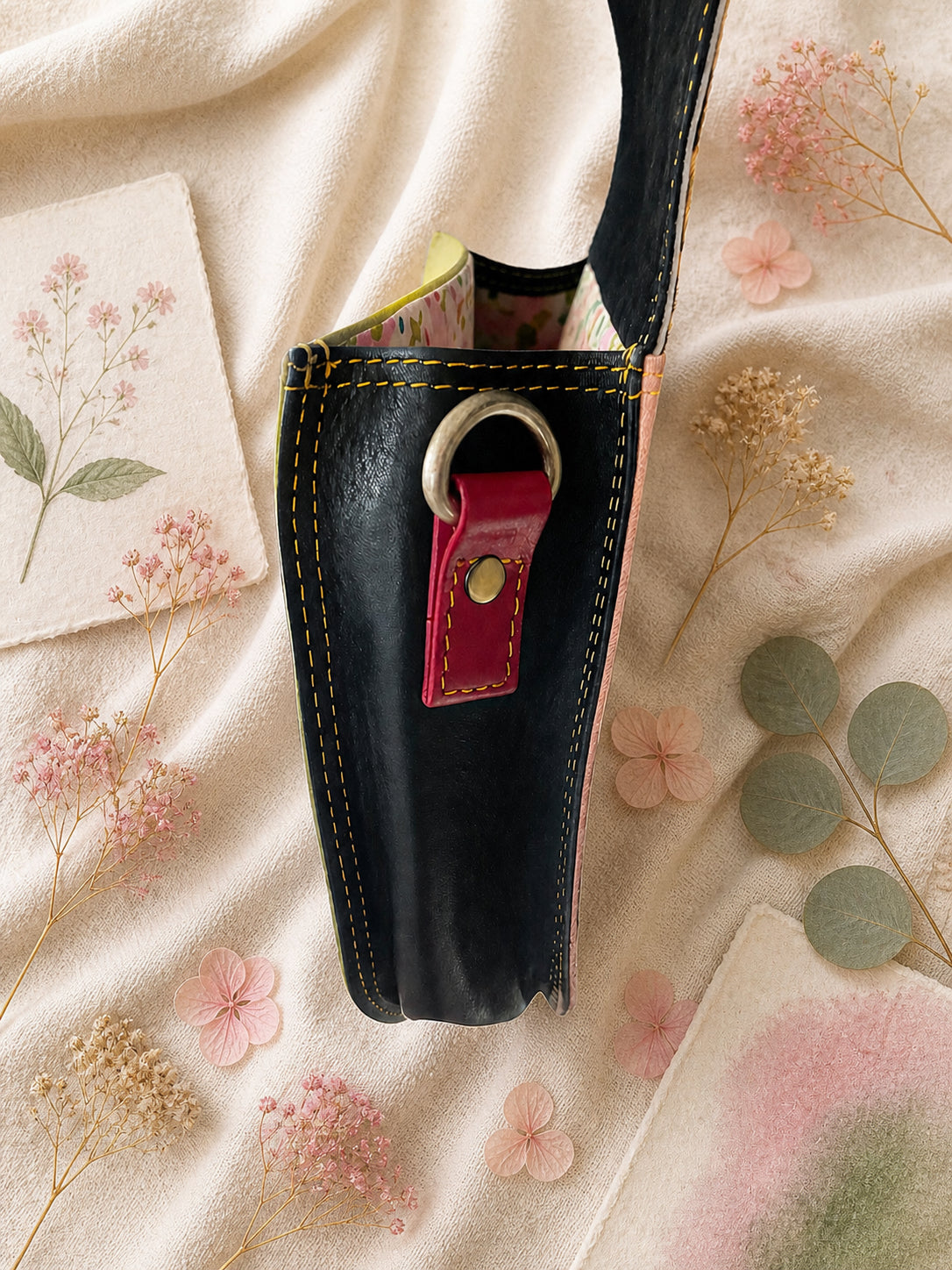 Handmade Leather Crossbody Bag in vibrant colors with leopard print flap on a textured background.