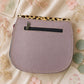 Handmade Leather Crossbody Bag in vibrant colors with leopard print flap on a textured background.