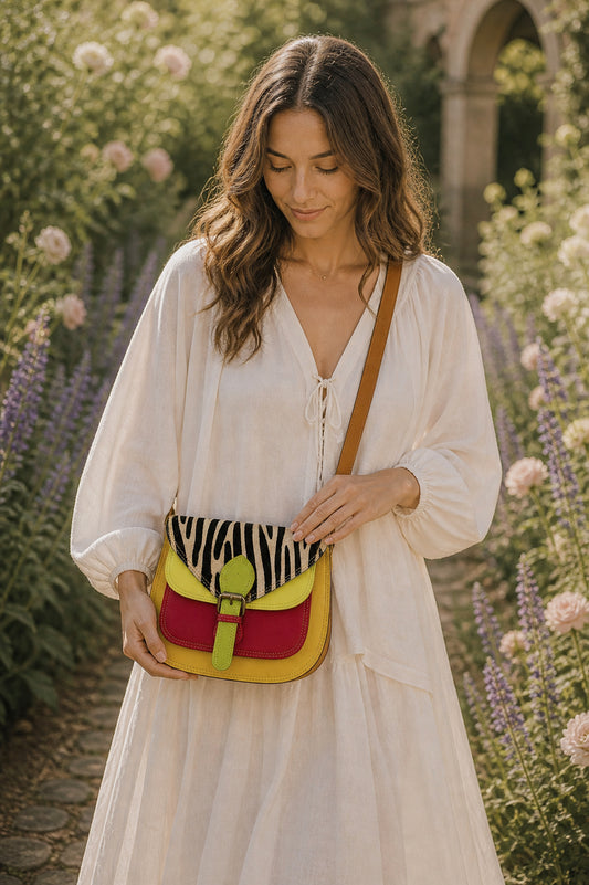 Handmade Leather Crossbody Bag - Romy with colorful zebra print and vibrant colors on a floral background.