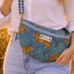 Handmade Cross Body Bag - Elara - Wildflower Path - Nyla worn by a model in a field during golden hour.
