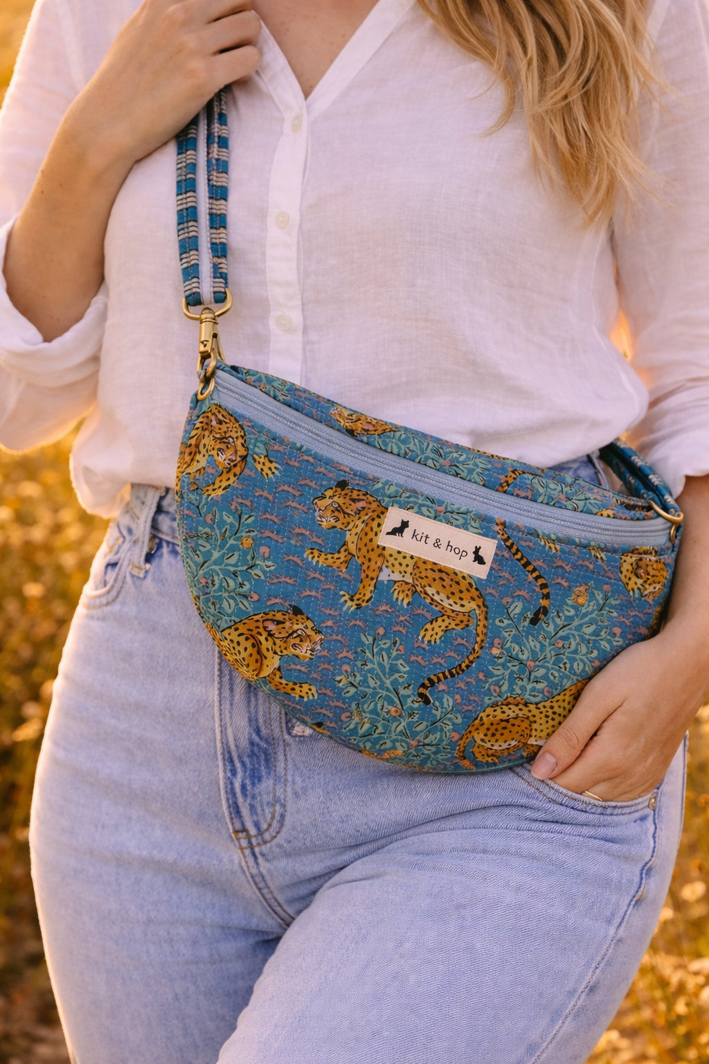 Handmade Cross Body Bag - Elara - Wildflower Path - Nyla worn by a model in a field during golden hour.