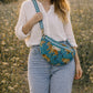 Handmade Cross Body Bag - Elara - Wildflower Path - Nyla worn by a model in a field during golden hour.