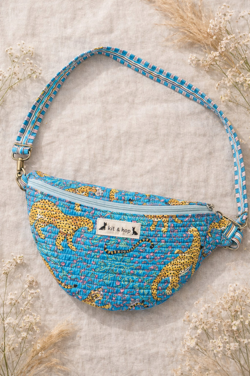 Handmade Cross Body Bag - Elara - Wildflower Path - Nyla worn by a model in a field during golden hour.