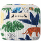 Handmade cross body bag Elara Wildflower Path in ANIMAL PRINT worn by woman in a field.