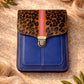 Handmade Leather Crossbody Bag - Alba in Capri Blue with leopard print flap and pink stripe.