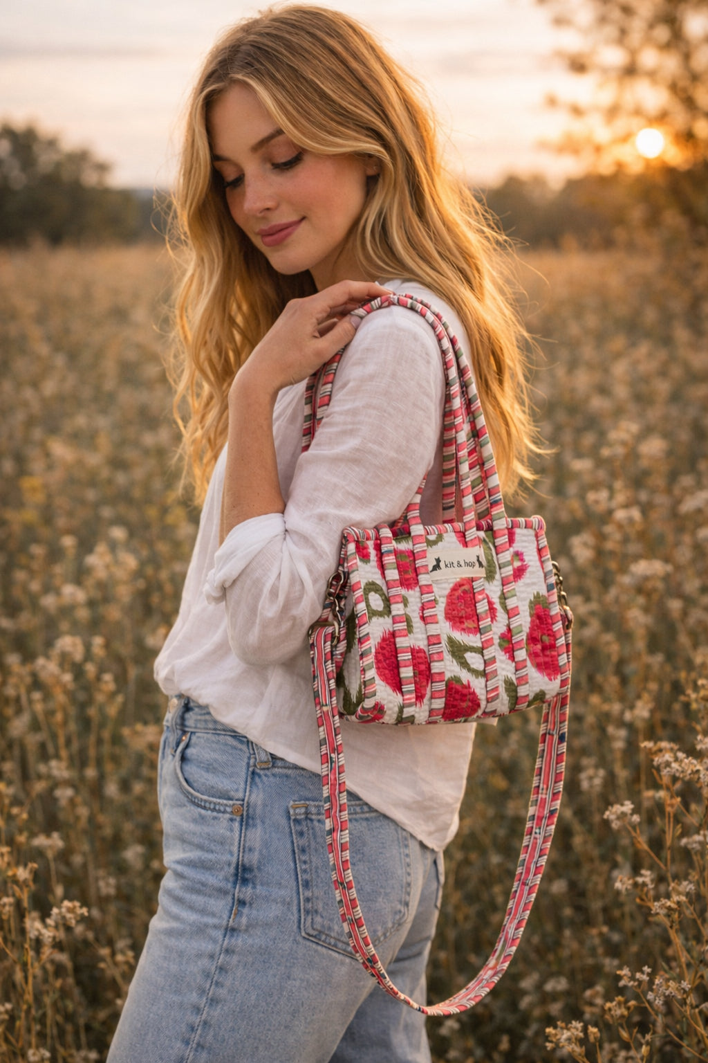 Handmade Cotton Mini Tote Bag - Lila - Wild Meadow - Arlo displayed on a wall with floral decor.