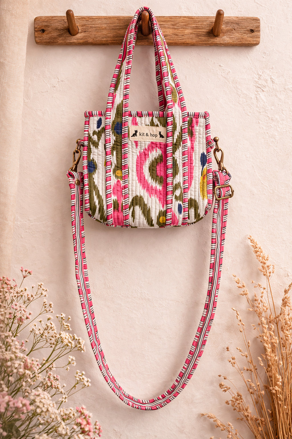 Handmade Cotton Mini Tote Bag - Lila - Wild Meadow - Arlo displayed on a wall with floral decor.