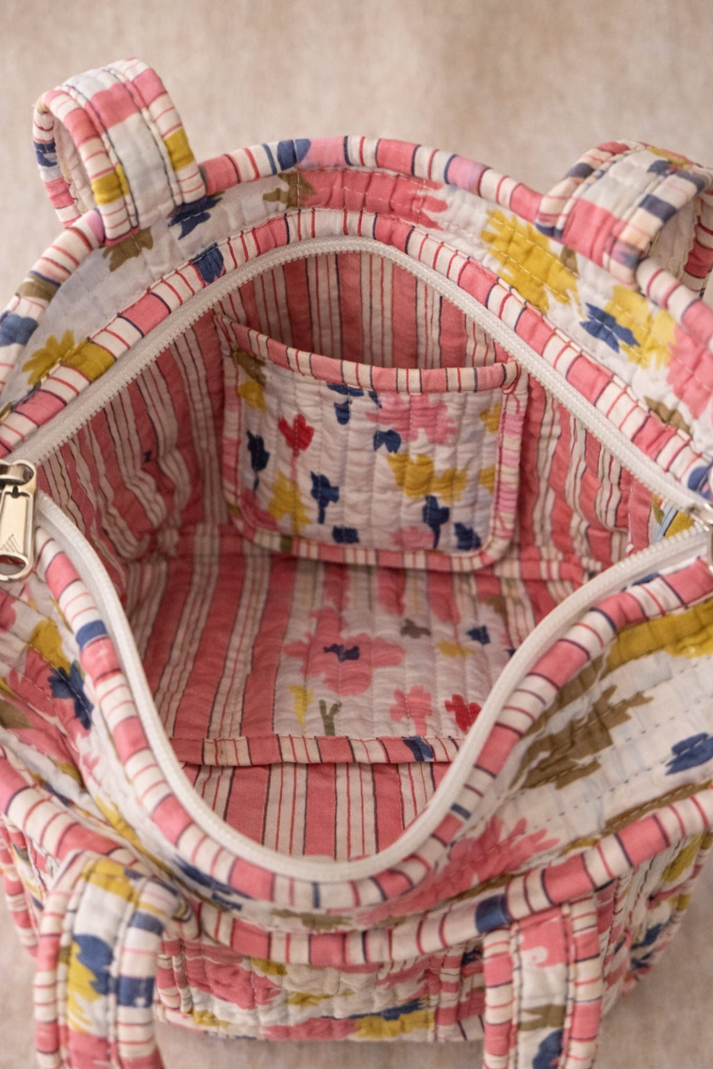 Handmade Cotton Mini Tote Bag - Lila - Wild Meadow - Arlo displayed on a wall with floral decor.