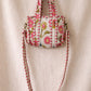 Handmade Cotton Mini Tote Bag - Lila - Wild Meadow - Arlo displayed on a wall with floral decor.