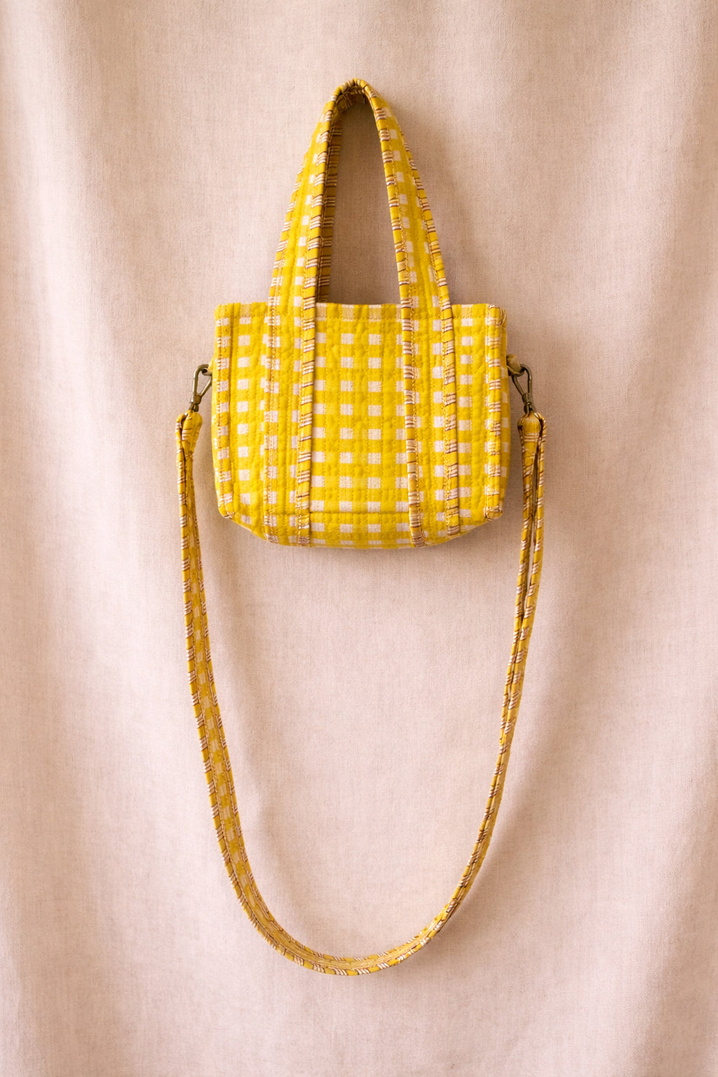 Handmade Cotton Mini Tote Bag - Lila in a yellow checked pattern, featuring adjustable straps and a soft, lightweight design.
