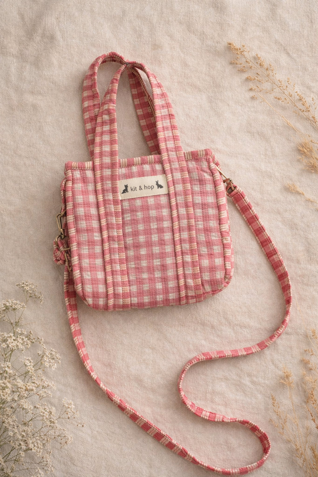 Handmade Cotton Mini Tote Bag in pink checkered pattern, hanging on a wooden hook, perfect for everyday use.