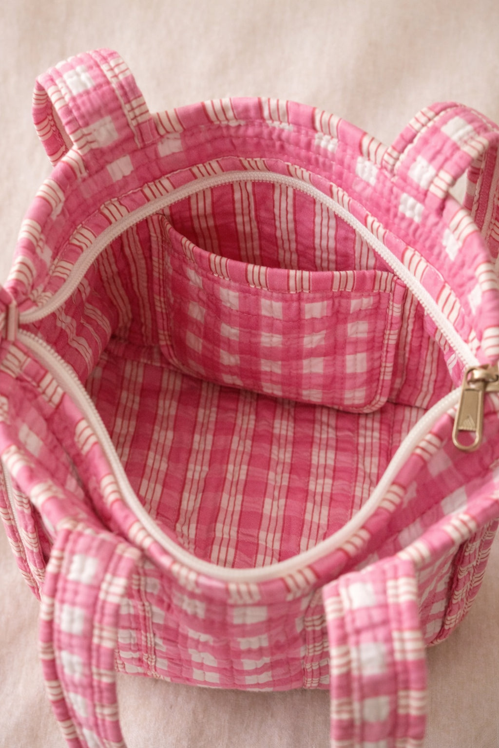 Handmade Cotton Mini Tote Bag in pink checkered pattern, hanging on a wooden hook, perfect for everyday use.