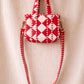 Handmade Cotton Mini Tote Bag with red and white diamond pattern, hanging on a wall, showcasing its stylish design.