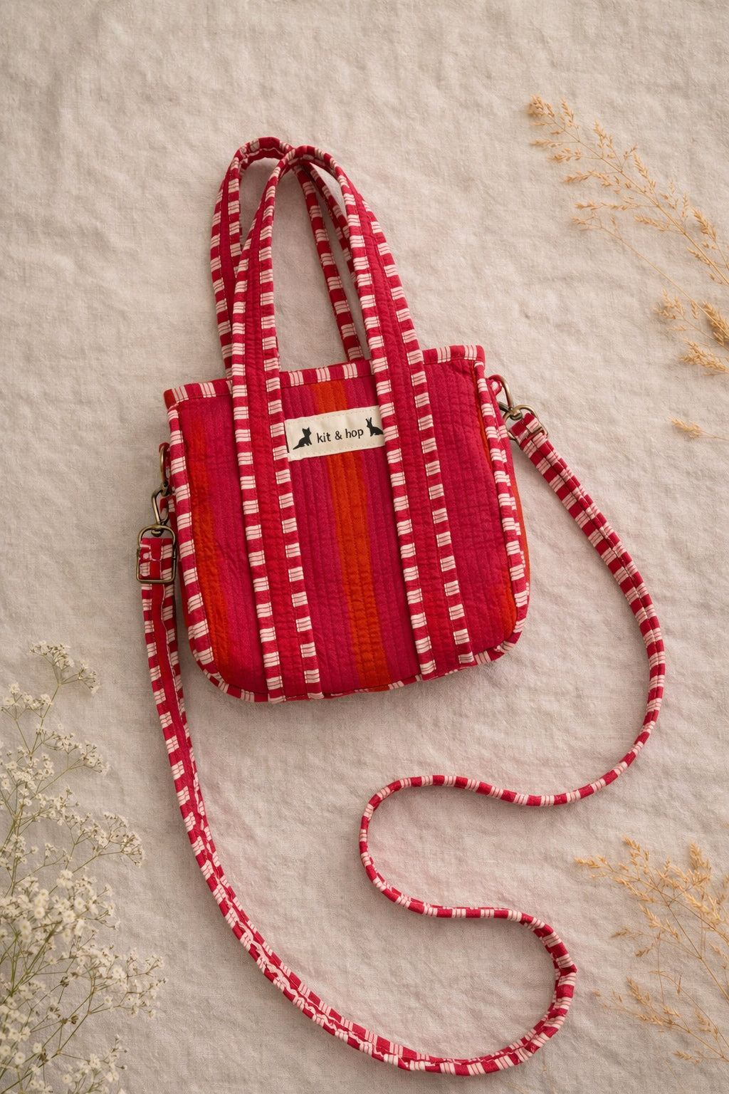 Handmade Cotton Mini Tote Bag - Lila - Wild Meadow - Peony displayed on a wall hook with floral background.