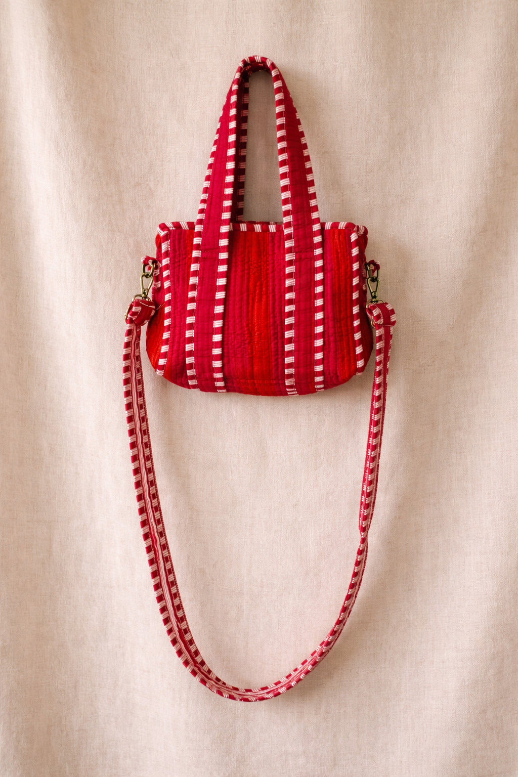 Handmade Cotton Mini Tote Bag - Lila - Wild Meadow - Peony displayed on a wall hook with floral background.