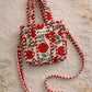 Handmade Cotton Mini Tote Bag - Lila - Wild Meadow - Poppy hanging on a wooden hook, showcasing its floral design.