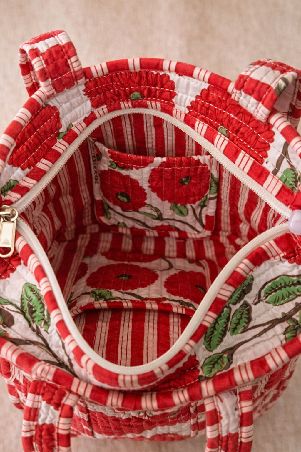 Handmade Cotton Mini Tote Bag - Lila - Wild Meadow - Poppy hanging on a wooden hook, showcasing its floral design.