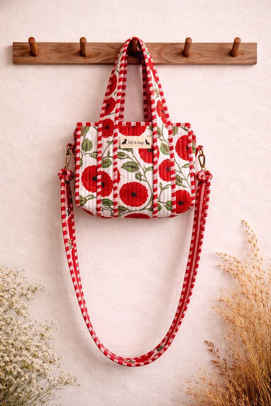 Handmade Cotton Mini Tote Bag - Lila - Wild Meadow - Poppy hanging on a wooden hook, showcasing its floral design.