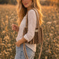 Handmade Cotton Mini Tote Bag - Lila - Wild Meadow -Sable with a stylish leopard print design, hung on a wooden hook.