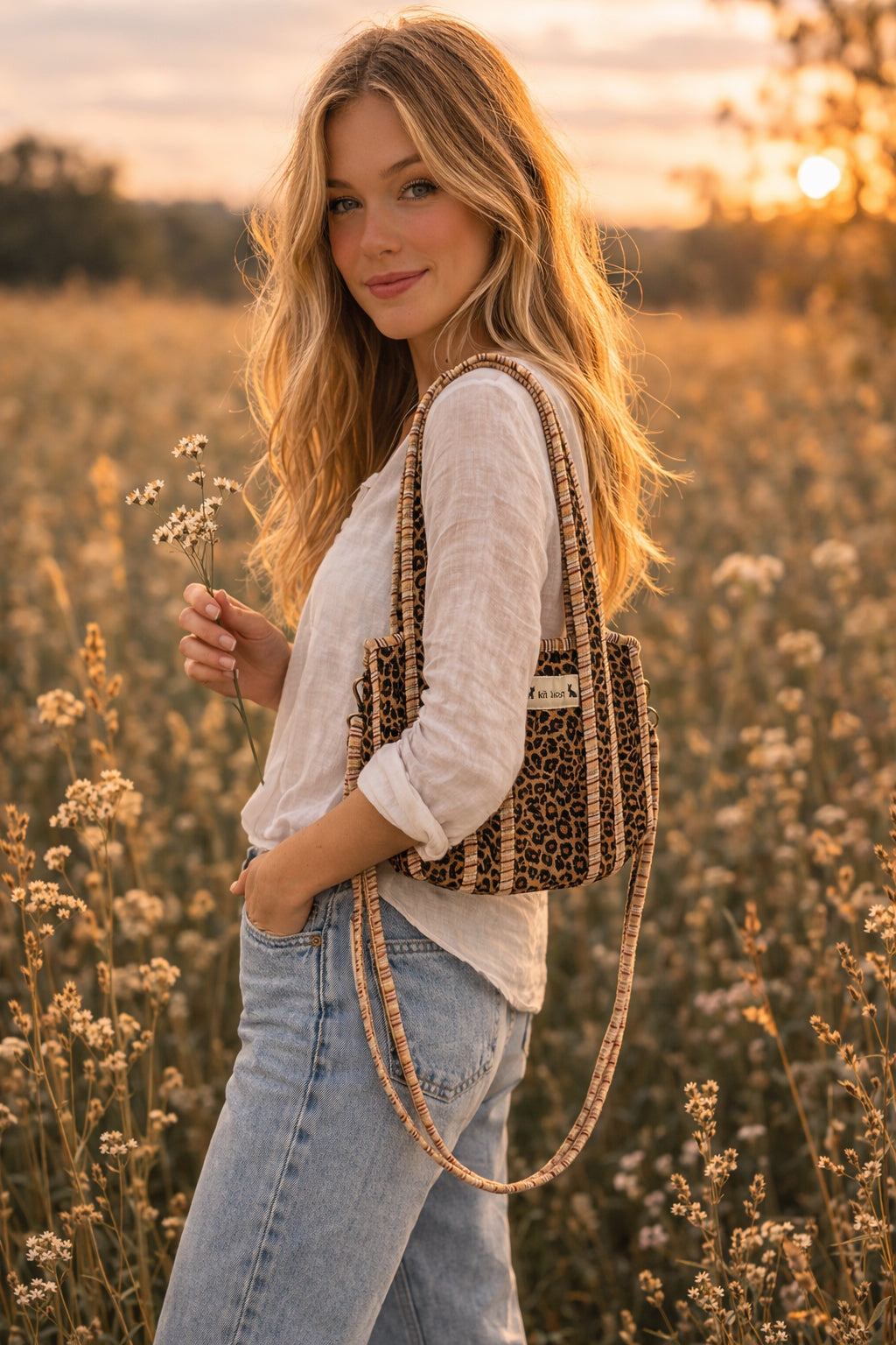 Handmade Cotton Mini Tote Bag - Lila - Wild Meadow -Sable with a stylish leopard print design, hung on a wooden hook.