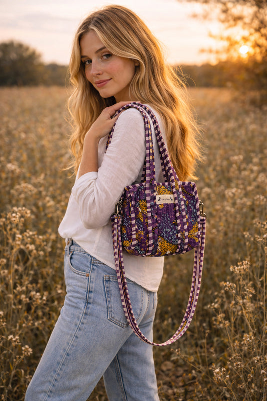 Handmade Cotton Mini Tote Bag in Wild Meadow Violet hanging on wall, perfect for everyday essentials.