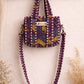 Handmade Cotton Mini Tote Bag in Wild Meadow Violet hanging on wall, perfect for everyday essentials.