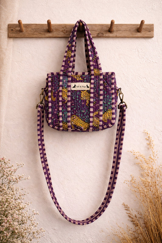 Handmade Cotton Mini Tote Bag in Wild Meadow Violet hanging on wall, perfect for everyday essentials.