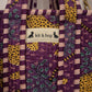 Handmade Cotton Mini Tote Bag in Wild Meadow Violet hanging on wall, perfect for everyday essentials.